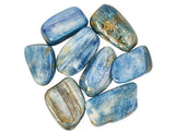 A collection of blue Kyanite tumble stones of various sizes.